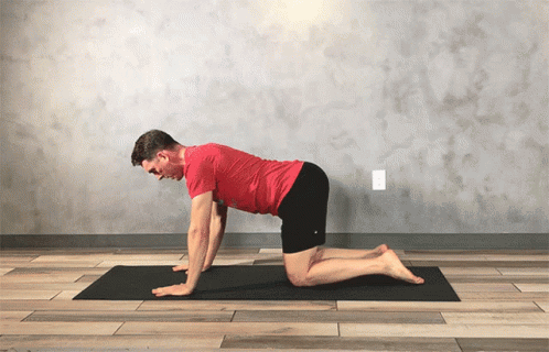 man wearing blue and black doing yoga