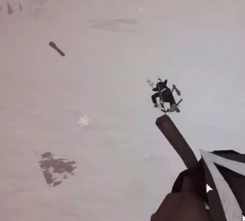 a person flying through the air while riding on a snowboard