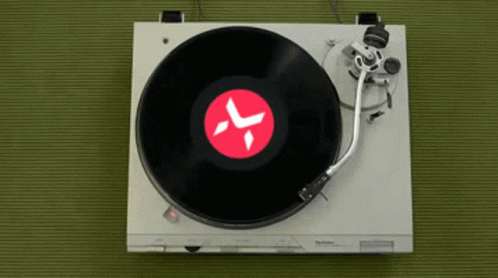 a record player has an image of a clock on it