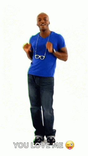 a man in an orange shirt poses in front of a blue background