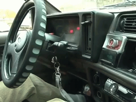 a vehicle with steering wheel controls and dashboard controls