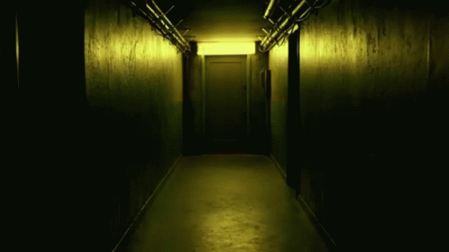 the dark hallway with the glow is empty
