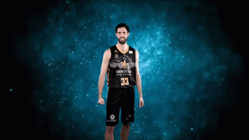 man in basketball uniform on yellow dusted background