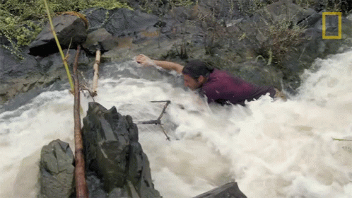 there is a man on the river rapids