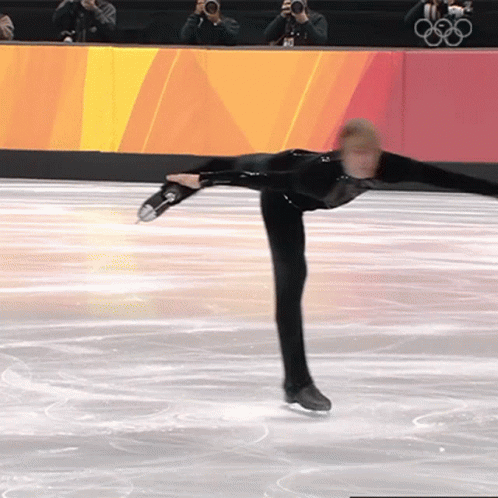 an olympic figure is performing a trick on ice