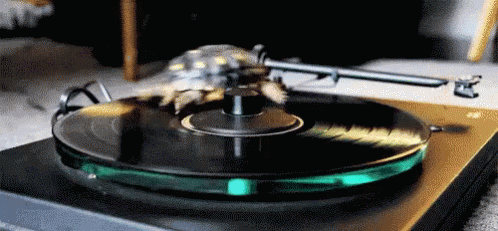 the turntable is green and has metal handle