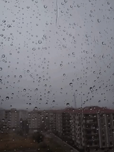 view of a rainy sky from outside of a window