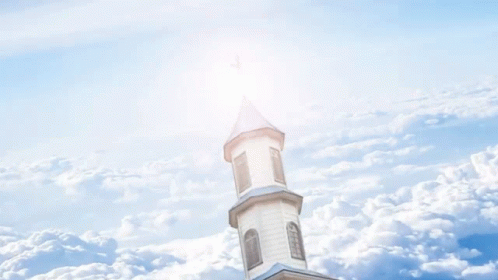 a building with a steeple rising out of the clouds