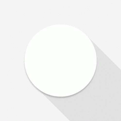 a white circle is sitting in the middle of a white surface