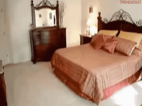 a large bed in the middle of a room