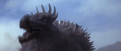 a large godzilla with a sharp knife is standing in front of the wall