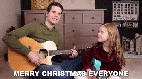 man and little girl singing and playing guitar with text over the top that reads merry christmas everyone