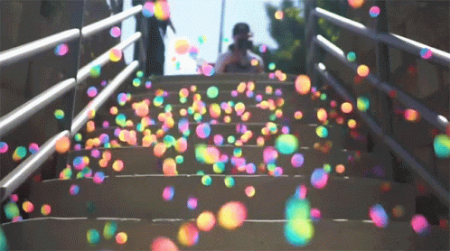 a couple of stairs covered with colorful balls