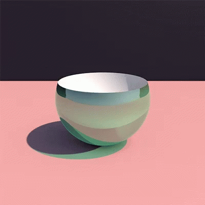 a white and green bowl sitting on top of a blue surface