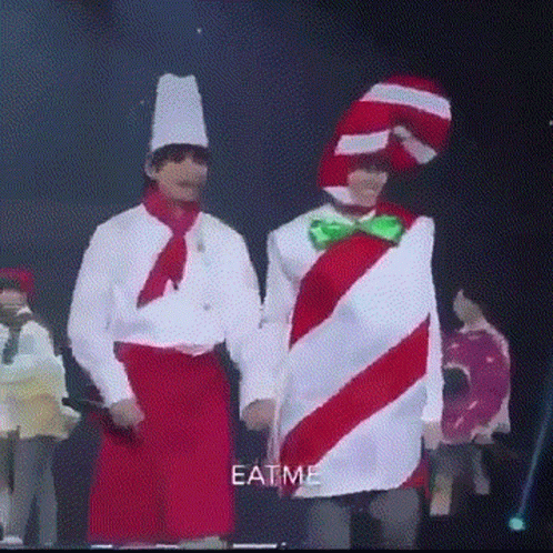some men standing in costumes on a stage
