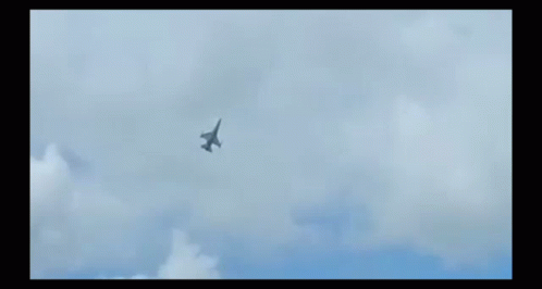 an airplane flying high in the sky while smoke fills the background