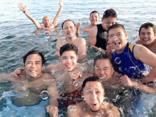 a group of people are having fun together in the water