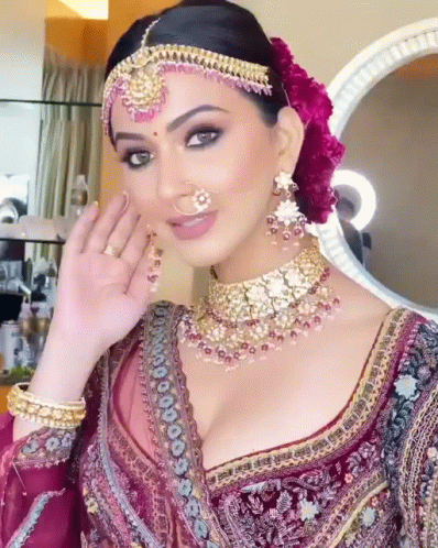 a lady wearing a very ornate costume and diamond jewelry