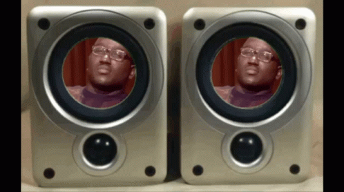an image of a man in a face on two speakers