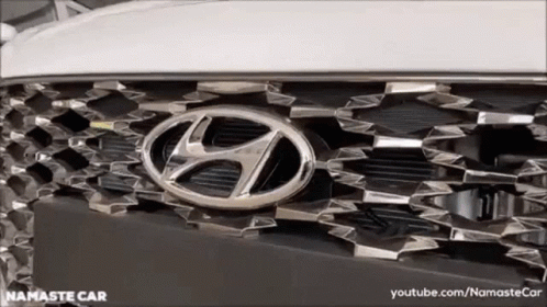 a white and black toyota car has a badge