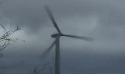 there is a wind farm with four wind turbines
