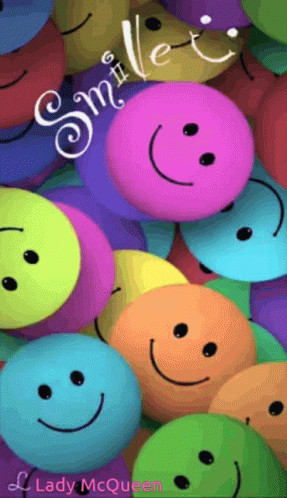 many colorful smiley faces on the front of a case