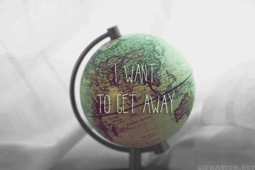 a green globe with a black stand and text that says i want to get away