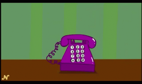 a purple phone is against a green background