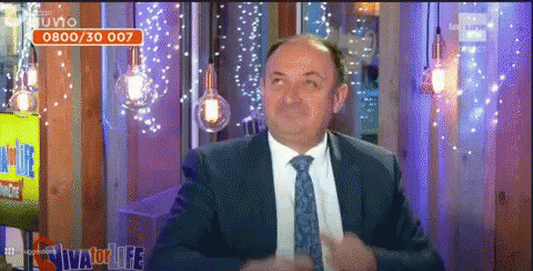 a man in a suit and tie on the tv show a thing called charlie brown