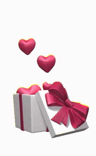 a heart shaped object being dropped from a gift box