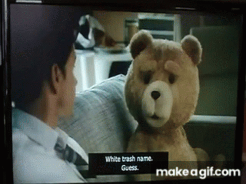 a television screen showing a man and a teddy bear