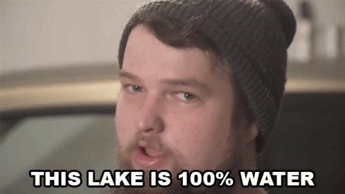 a man with purple makeup has words reading this lake is 100 % water