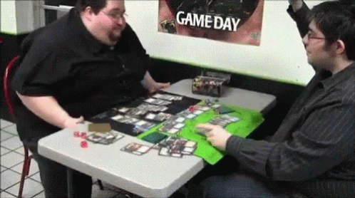 two men playing game with each other on a table