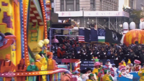 people are riding on floats in the parade
