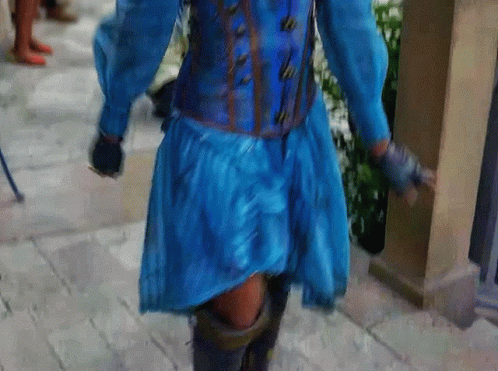 a man wearing a costume on the sidewalk