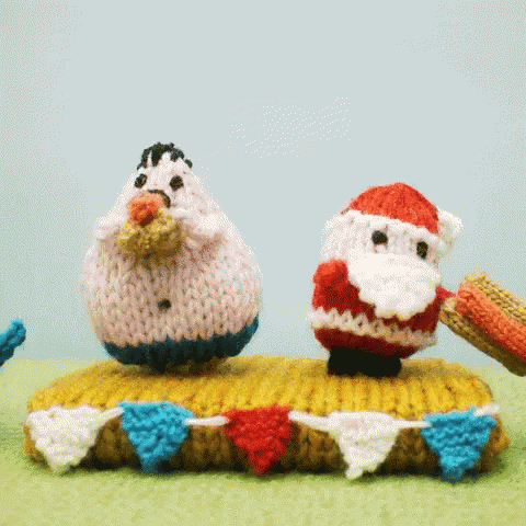 two knitted toys in the shape of two men