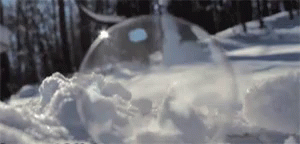 a view of water flowing from a well into an ice filled tub