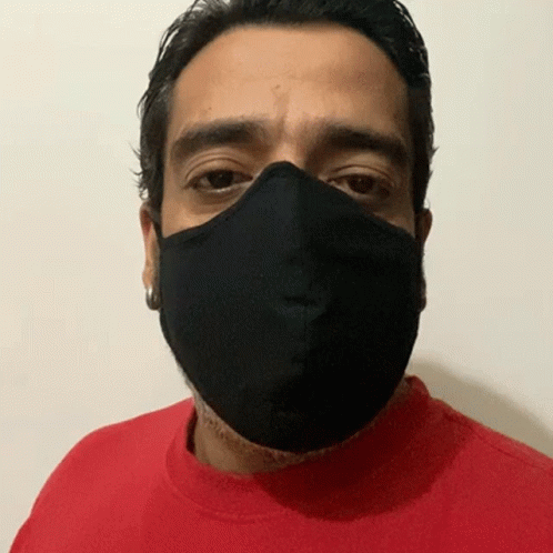 a man in blue shirt with face mask