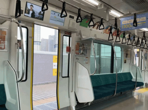 a subway car is empty of passengers and empty seats