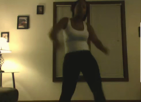 this is a blurry image of a person performing some dance moves