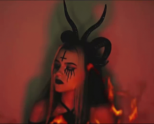 a woman with fake horns on her head and eyes
