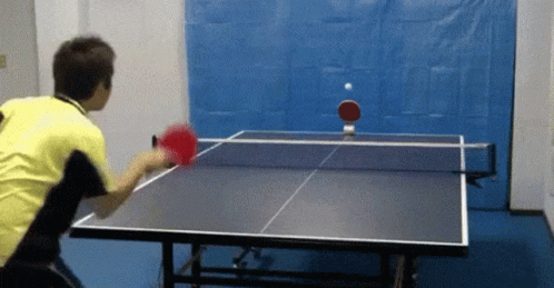 a man is preparing to play table tennis
