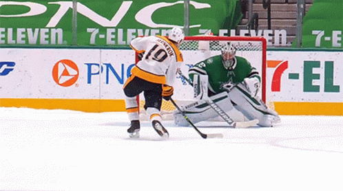 goalie attempts to block the goal on goalie from making it to the net