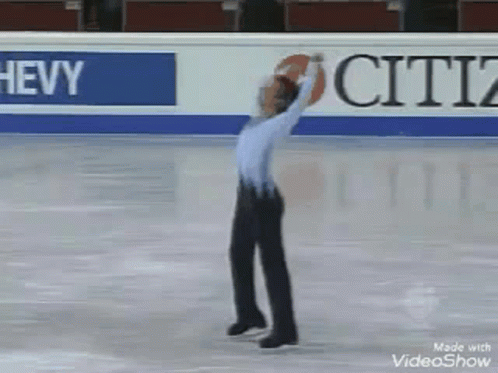 a man on ice skates is getting ready to kick