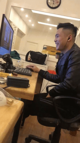 a man sits in front of a computer