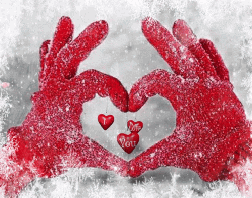 two hands making a heart in the snow