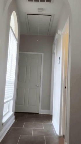 an archway leading into a white room