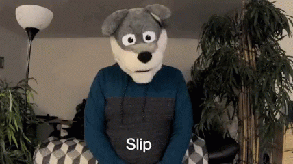 a person is in a wolf costume sitting on a bed