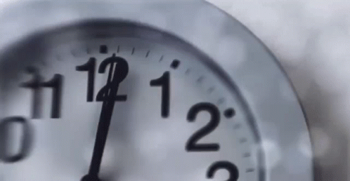 an analog clock shows twenty one five in the morning