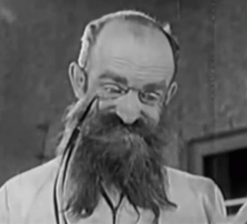 an old black and white po of a man with beard